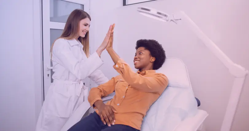 patient high fiving a doctor