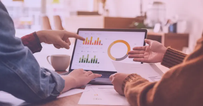 marketer and client discussing analytics