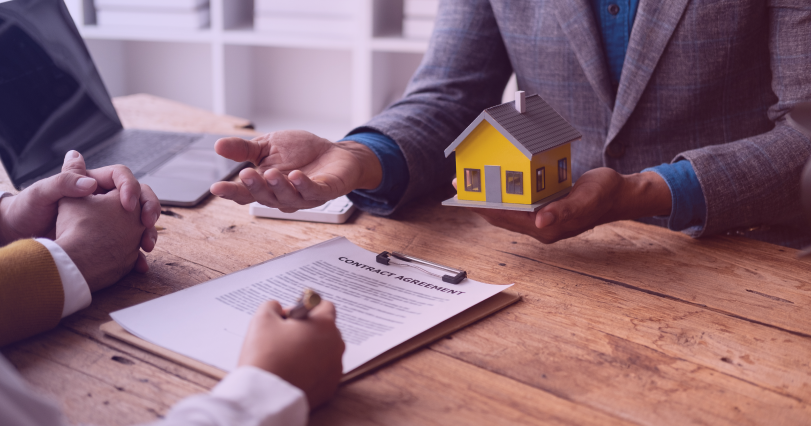 real estate agent discussing confidential contract terms with property buyer
